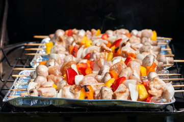 preparation for the barbecue - raw skewers on a tray