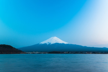 Fototapeta premium Mt. Fuji rises above Lake Kawaguchi