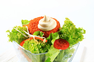 Green salad with fried breaded cheese