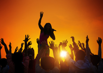 Young Woman Singing in Front of the Audience