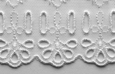 White flowers and leaves lace material texture macro shot