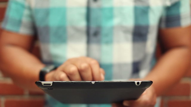 Close Up Young Man Using Tablet Computer Touchscreen