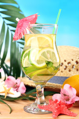 Refreshing cocktail on beach table