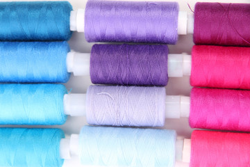 Multicolor sewing threads background