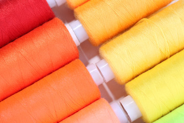 Multicolor sewing threads background