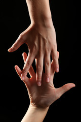 Fototapeta premium Human hands on black background