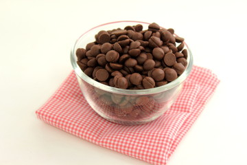 chocolate chip in glass cup on white background