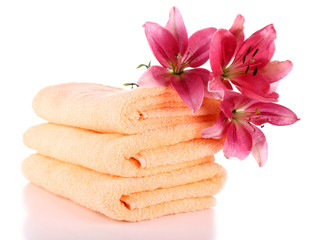 Color towels and lily flowers, isolated on white