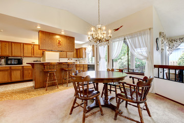 Bright kitchen room with rustic dining table set