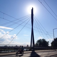 sun behind the bridge