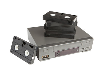 stack of videotapes on videorecorder isolated on white
