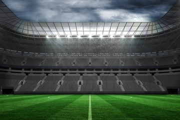 Fototapeta na wymiar Large empty football stadium with lights