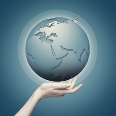 Earth globe into female hand, abstract eco backgrounds