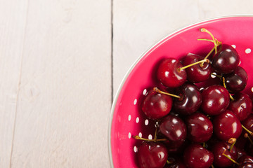 Cherries in pink colander