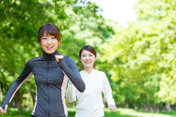 young asian women jogging in the park