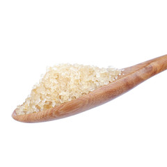 granulated sugar in spoon isolated on white background