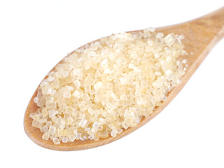 granulated sugar in spoon isolated on white background