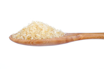 granulated sugar in spoon isolated on white background