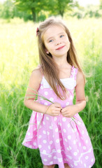 Fototapeta na wymiar Portrait of adorable smiling little girl