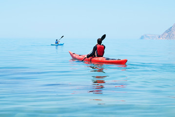 Kayak. People kayaking in the ocean. Active people. Sport
