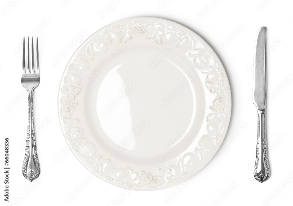 Wall mural vintage plate, knife and fork on white background