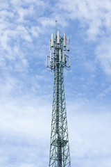 Green mobile phone pole with blue sky and cloud