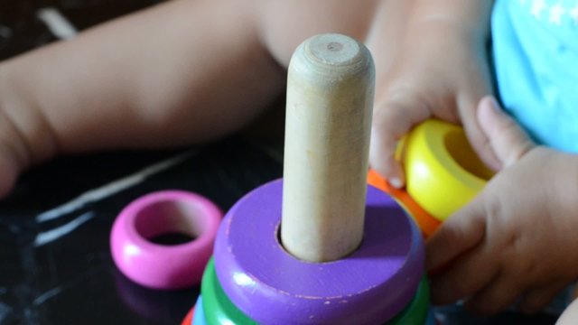 Child having fun with wooden toys