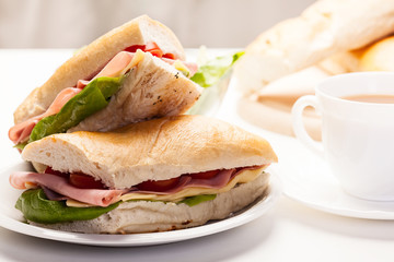 Panini sandwich with ham, cheese and tomato