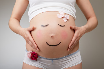 Pregnant belly look like a smiling face