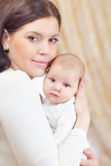 portrait of lovely mother and newborn baby girl