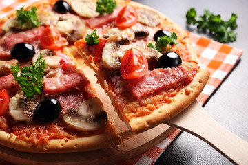 Pizza with Ham, Mushrooms, olives and parsley