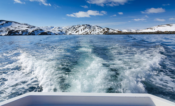 Boat Traveling In Barents Sea