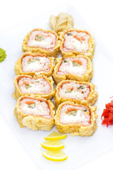 Japanese rolls in a restaurant with fish and vegetables