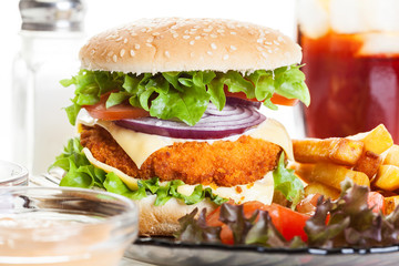 Chickenburger and glass of cola with ice