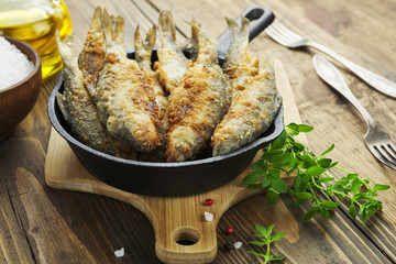 Fried fish in a frying pan