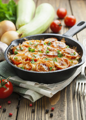 Courgettes baked with tomato and cheese