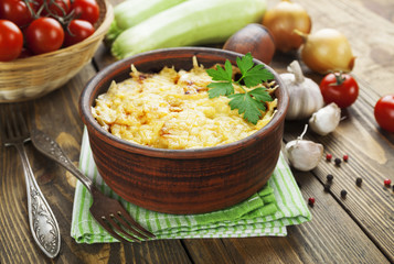 Courgettes baked with tomato and cheese