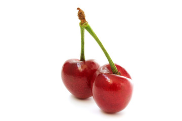 Two cherries side view