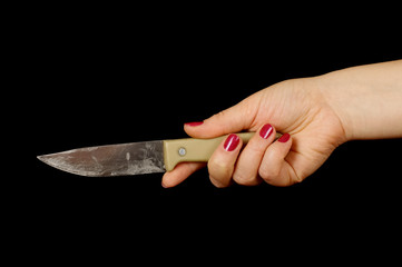 Female hand stab knife isolated on the black background