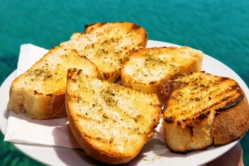 Bruschetta in front of Mediterranean sea.