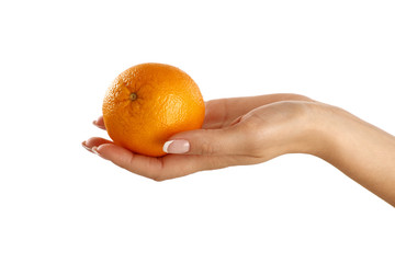 Delicious orange in a female beautiful hand