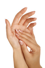 Beautiful female hands applying a skincare massage