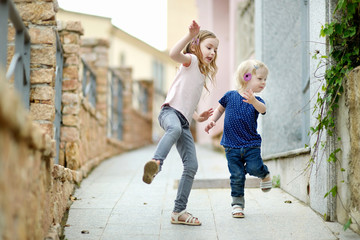Portrait of two little sisters outdoors