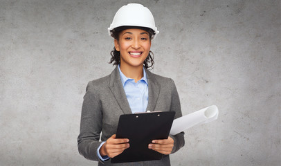 businesswoman in white helmet with clipboard