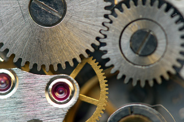 Metallic Background with metal cogwheels a clockwork. Macro