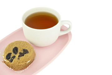 Tea in white cup and cake isolated