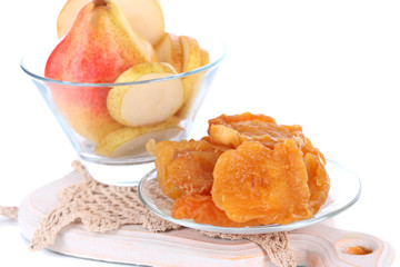 Dried pears in glass bowl, isolated on white