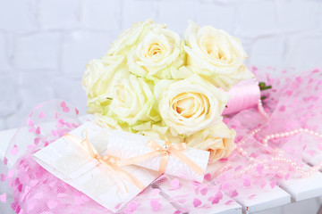 Beautiful wedding bouquet with roses on grey wall background