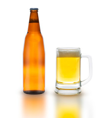 Bottle of beer with glass isolated on white