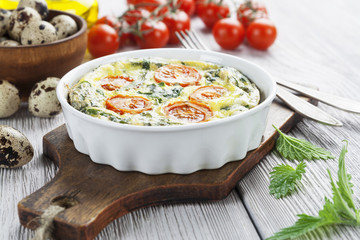 Quail eggs scrambled with nettle and cherry tomatoes